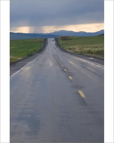 USA, Washington State. Storm clouds and rain ahead over the road in Central Washington