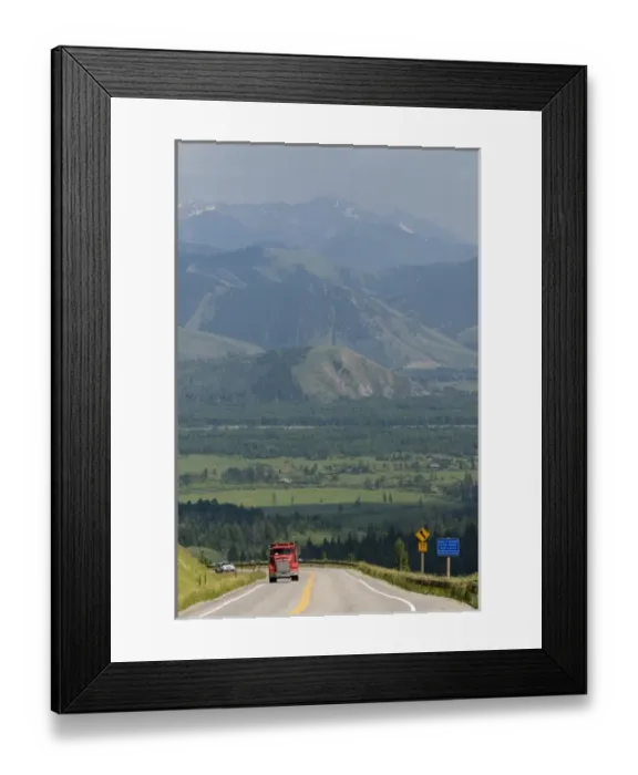Framed Print : Dump truck traveling over the high mountain Teton Pass on Wyoming Highway 22 near Framed Print : Dump truck traveling over the high mountain Teton Pass on Wyoming Highway 22 near