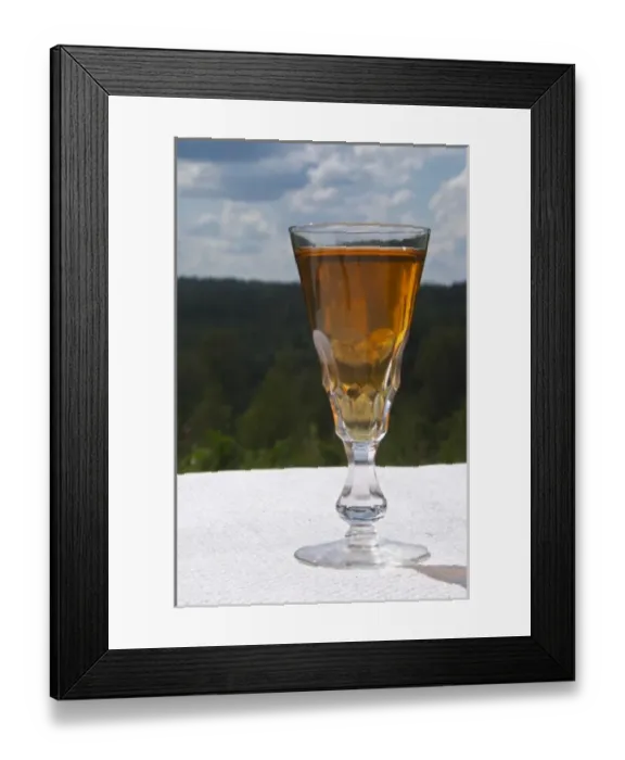 Framed Print : Swedish traditional aquavit schnapps glass in pointed form filled to the brim with spiced vodka Framed Print : Swedish traditional aquavit schnapps glass in pointed form filled to the brim with spiced vodka