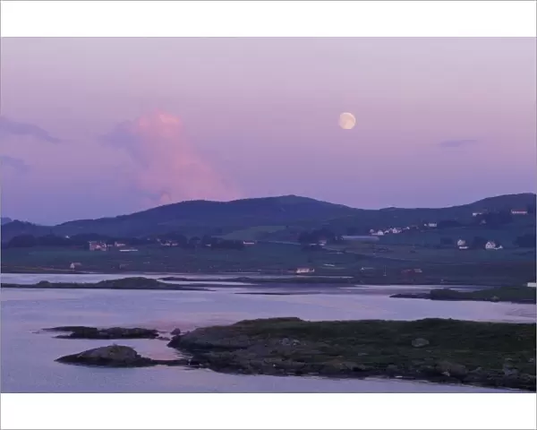Europe, Norway, Hildefjord. Full moon rises above farmland north of Stavanger