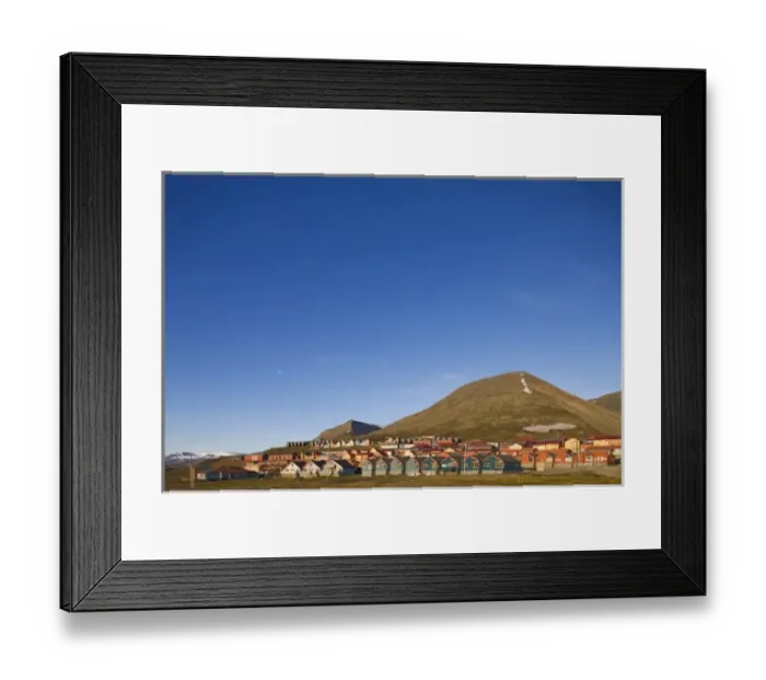 Framed Print : Norway, Svalbard, Longyearbyen, Setting midnight sun lights rows of brightly colored houses
