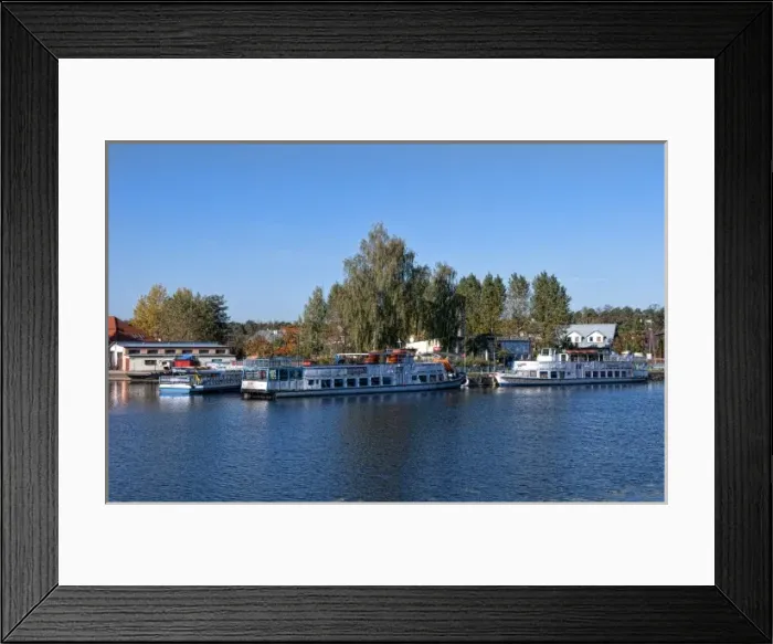 Framed Print : Ferry rides ships in village of Augustow, Poland Framed Print : Ferry rides ships in village of Augustow, Poland