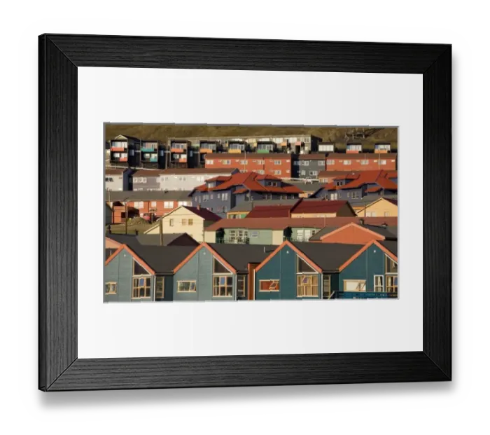 Framed Print : Norway, Svalbard, Longyearbyen, Setting midnight sun lights rows of brightly colored houses