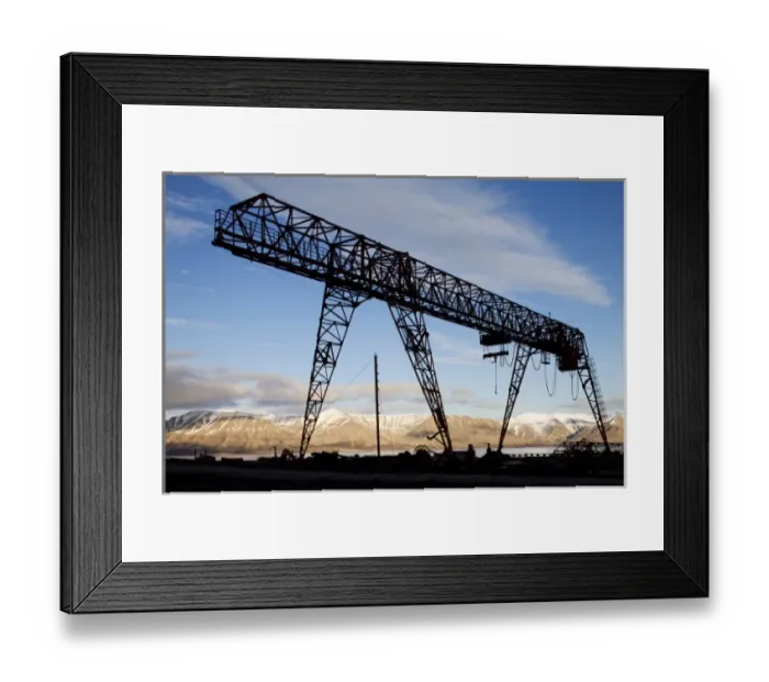 Framed Print : Norway, Svalbard, Pyramiden, Silhouette of loading crane along waterfront at abandoned