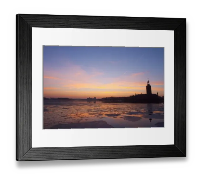 Framed Print : Sunset over an ice covered Riddarfjarden water towards the west with Kungsholmen