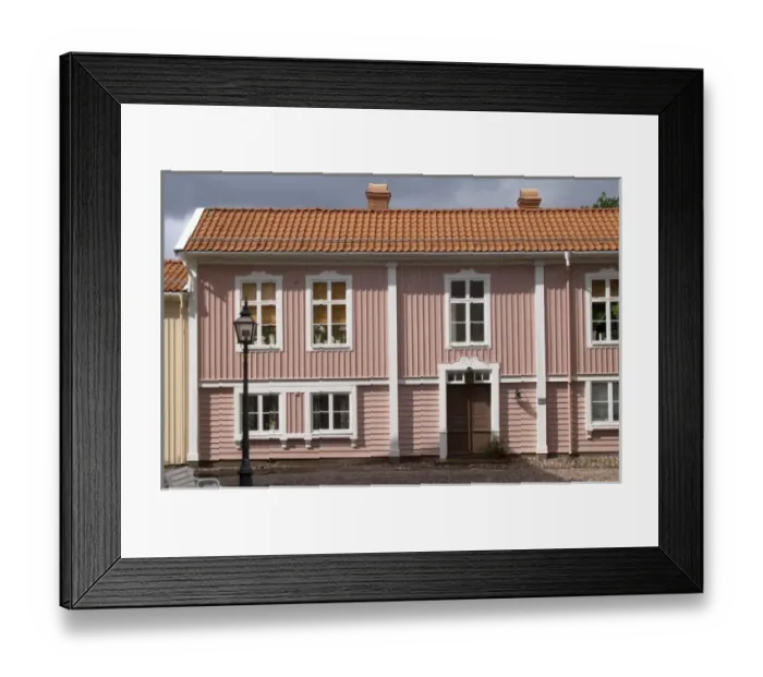 Framed Print : A street scene from the old town where there are many unique old wooden houses. Peder skomakares