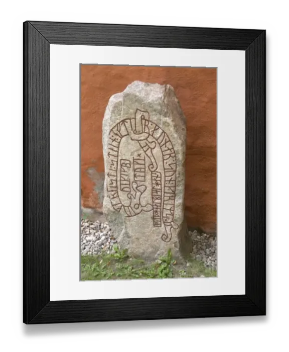 Framed Print : Rune stone outside the cathedral dating from the 11th century. The stone was put Framed Print : Rune stone outside the cathedral dating from the 11th century. The stone was put