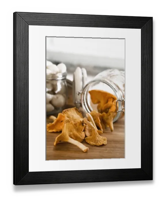 Framed Print : Stockholm, Sweden - Closeup of dried mushrooms coming from a jar thats lying on a countertop Framed Print : Stockholm, Sweden - Closeup of dried mushrooms coming from a jar thats lying on a countertop