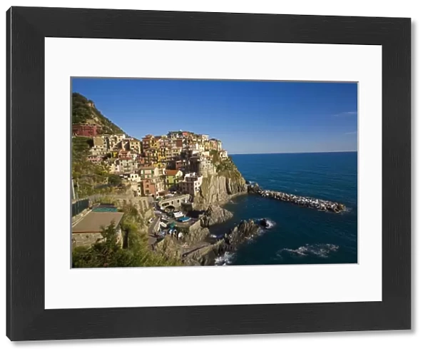 Italy, Cinque Terre, Manrola, Hillside Town of Manrola with the Mediterranen Sea