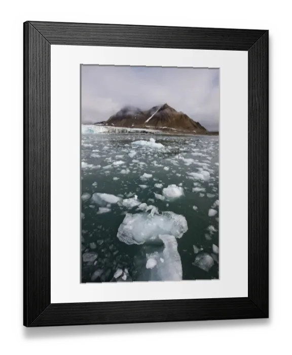 Framed Print : Norway, Svalbard, Spitsbergen Island, Icebergs float in sea near face of glacier