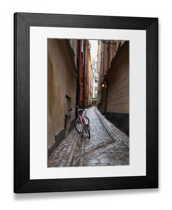 Framed Print : Stockholm, Sweden - A bicycle sitting in a narrow alley going between two old world buildings Framed Print : Stockholm, Sweden - A bicycle sitting in a narrow alley going between two old world buildings