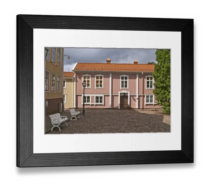 Framed Print : A street scene from the old town where there are many unique old wooden houses. Peder skomakares