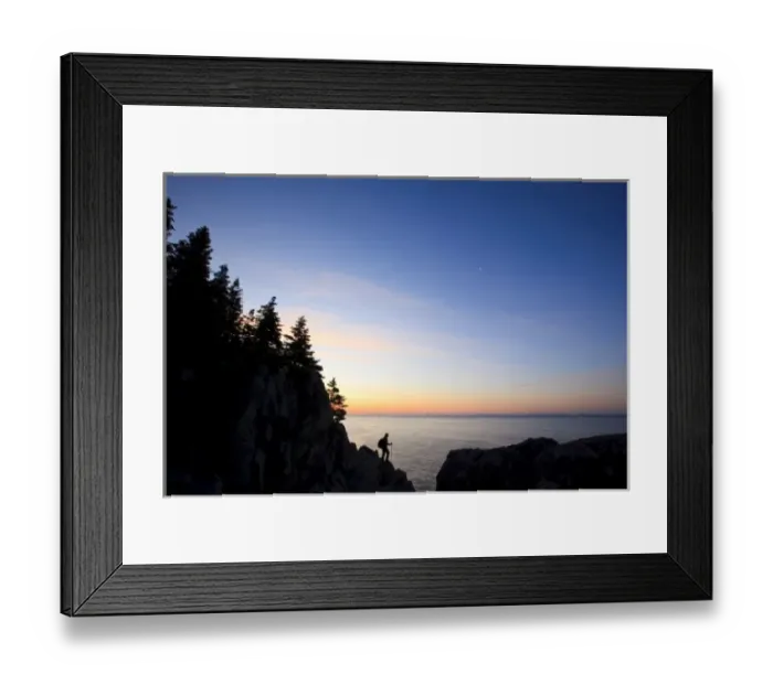 Framed Print : A lone hiker at sunrise on the Bold Coast trail in Cutler, Maine. Cutler Coast Public Reserved Land
