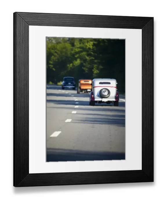 Framed Print : USA, Maine. Three antique cars traveling on a modern highway