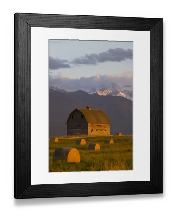 Framed Print : Old barn framed by hay bales and dramatic Mission Mountain Range in Montana Framed Print : Old barn framed by hay bales and dramatic Mission Mountain Range in Montana