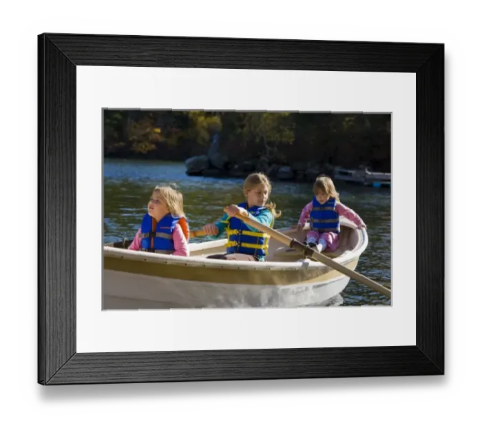 Framed Print : Three young girls (ages 3, 5, 9) in a row boat at Oliver Lodge on Lake Winnipesauke in Meredith