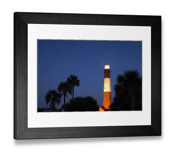 Framed Print : USA, Georgia, Tybee Island, Palmetto Palm trees and Tybee Lighthouse at dusk on summer