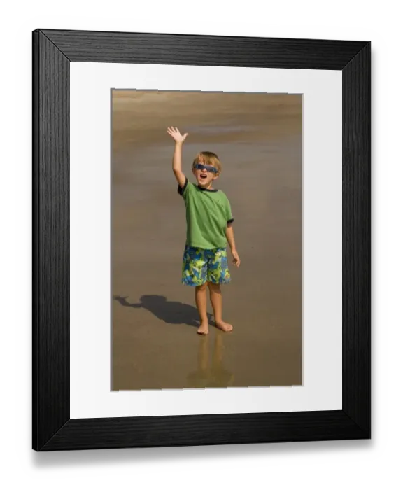 Framed Print : USA; Georgia; Young boy playing on the beach at Tybee Island GA. (MR) Framed Print : USA; Georgia; Young boy playing on the beach at Tybee Island GA. (MR)