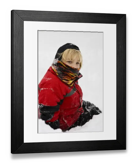 Framed Print : A young boy in the snow in his backyard in Portsmouth, New Hampshire Framed Print : A young boy in the snow in his backyard in Portsmouth, New Hampshire