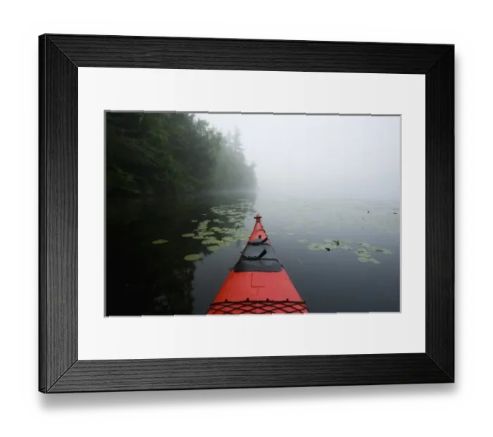 Framed Print : The bow of a kayak on a foggy morning on Mirror Lake in Woodstock, NH. Hubbard Brook