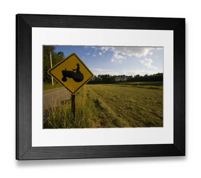 Framed Print : A tractor crossing sign next to a farm in Pepperell, Massachusetts Framed Print : A tractor crossing sign next to a farm in Pepperell, Massachusetts
