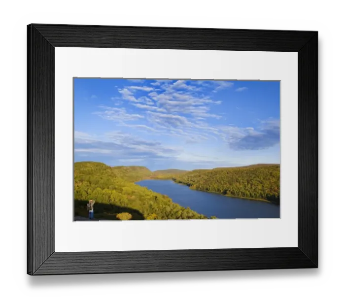 Framed Print : Hiker takes in the view at the Lake of the Clouds in Porcupine Mountains State Park