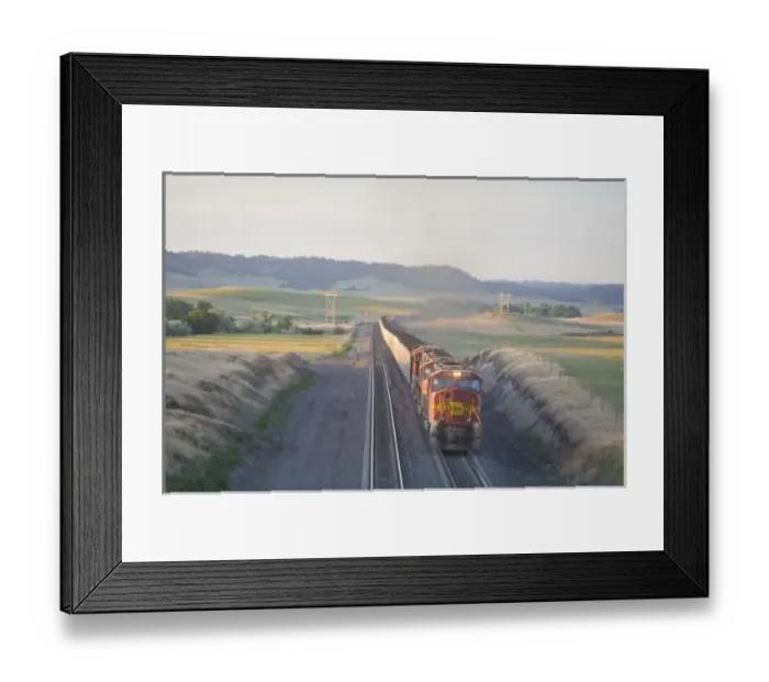 Framed Print : Another extremely long load of coal carried by train from Wyoming passes through