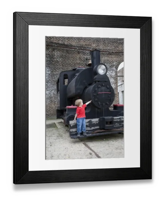 Framed Print : USA; Georgia; Savannah. Young boy at Roundhouse Train Museum. (MR)