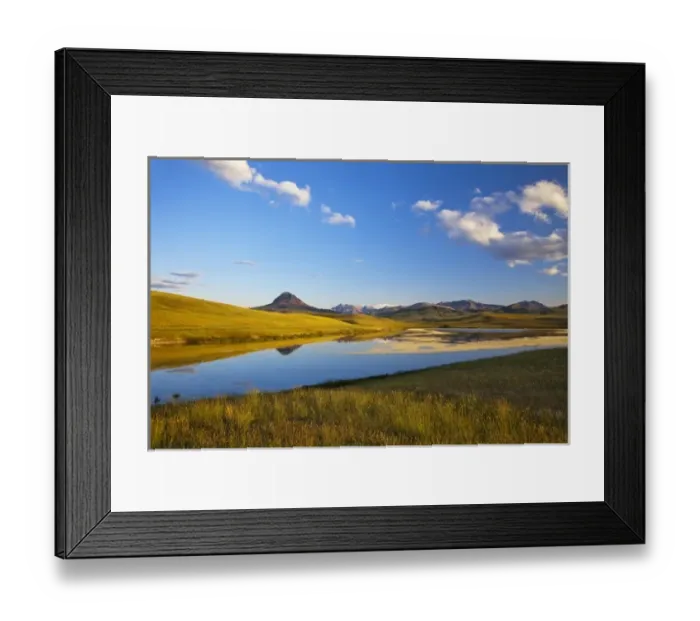 Framed Print : Small lake reflects Haystack Butte and the Rocky Mountain Front in Montana