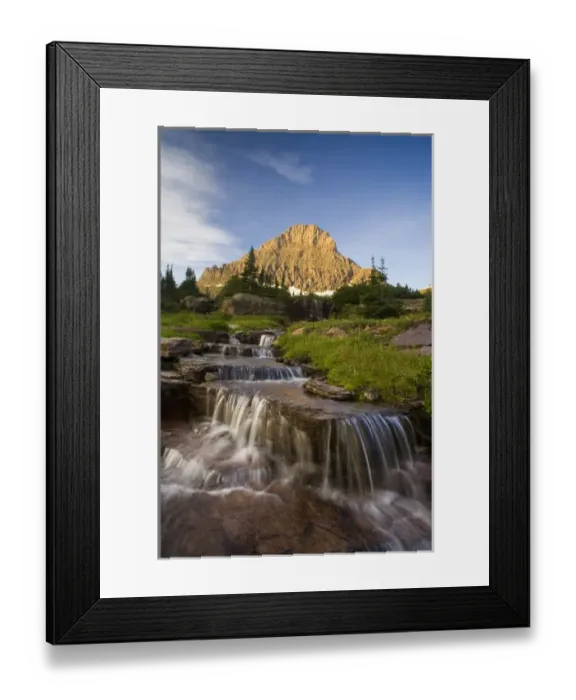 Framed Print : Water cascades down from Reynold Mountain at Logan Pass in Glacier National Park Montana