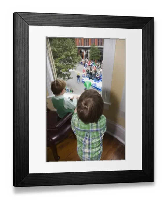 Framed Print : USA; Georgia; Savannah. Two young boys watching the St. Patricks Day Parade. (MR) Framed Print : USA; Georgia; Savannah. Two young boys watching the St. Patricks Day Parade. (MR)