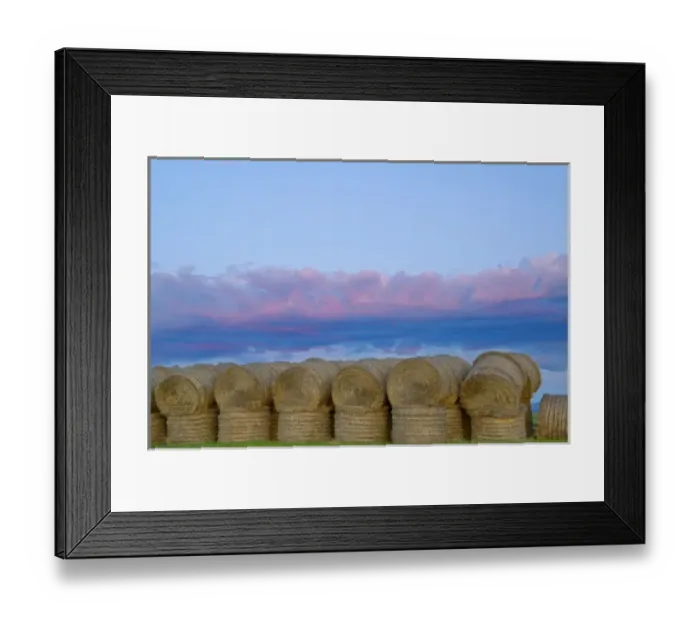 Framed Print : Sunset clouds over stack of hay bales near Lewistown Montana