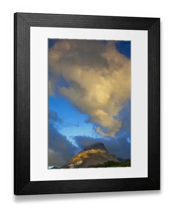 Framed Print : Storm clouds light up at sunrise above Mount Wilbur in the Many Glacier Valley of Framed Print : Storm clouds light up at sunrise above Mount Wilbur in the Many Glacier Valley of