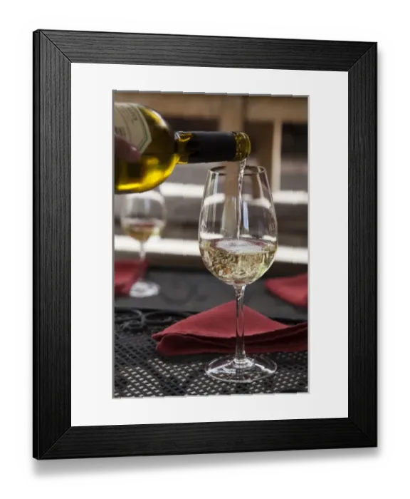 Framed Print : South America, Argentina, Mendoza. Pouring white wine into glass at Altus Vineyards