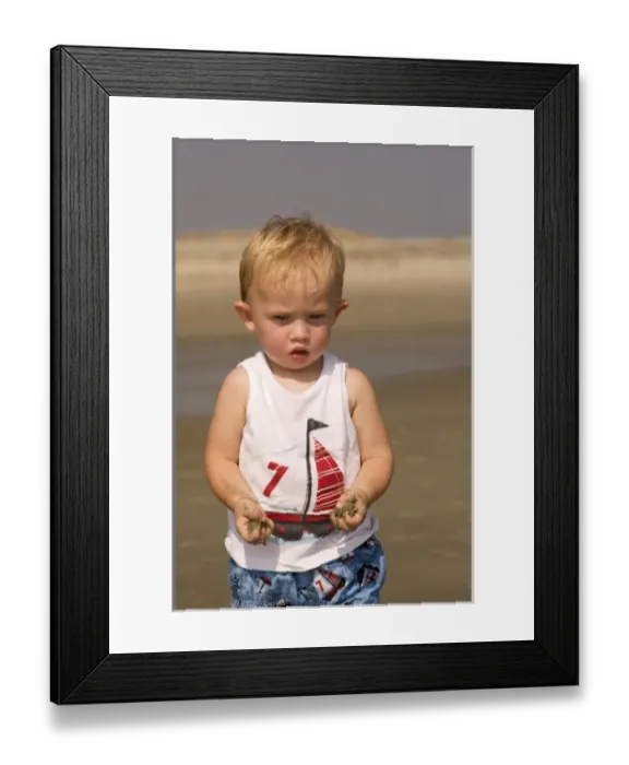 Framed Print : USA; Georgia; Little boy playing in the sand on the beach at Tybee island GA. (MR) Framed Print : USA; Georgia; Little boy playing in the sand on the beach at Tybee island GA. (MR)