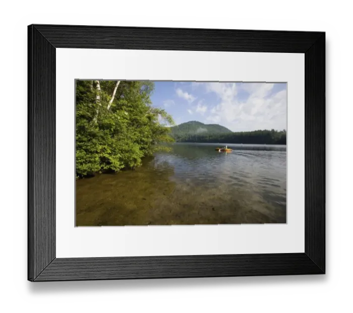 Framed Print : A kayaker on Mirror Lake near the Hubbard Brook Experimental Forest in Woodstock, NH