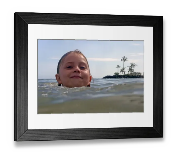 Framed Print : USA, Hawaii, Oahu. A young girl enjoys swimming in the waters of the Kahala Hotel & Resort Framed Print : USA, Hawaii, Oahu. A young girl enjoys swimming in the waters of the Kahala Hotel & Resort