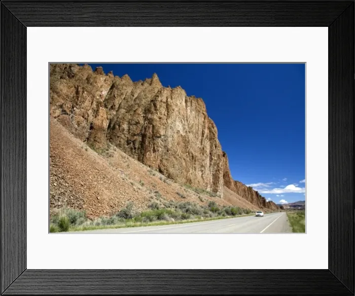 Framed Print : Car traveling on Idaho State Highway 75 near Challis, Idaho Framed Print : Car traveling on Idaho State Highway 75 near Challis, Idaho