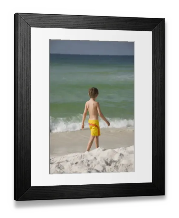 Framed Print : USA; Florida; Pensacola; Child walking on the beach. (MR) Framed Print : USA; Florida; Pensacola; Child walking on the beach. (MR)