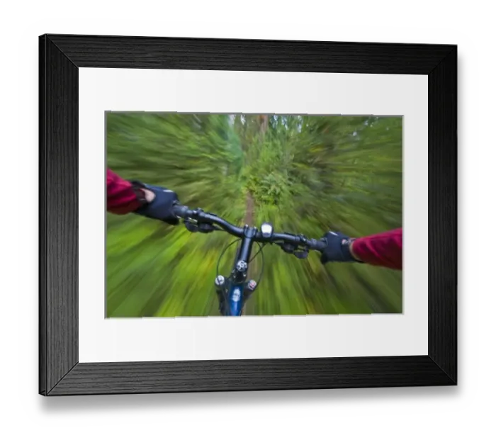 Framed Print : Cruising down a buff section of singletrack trail from the riders perspective near Framed Print : Cruising down a buff section of singletrack trail from the riders perspective near