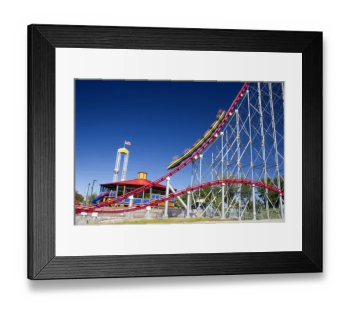 Framed Print : The Mamba roller coaster in motion at Worlds of Fun in Kansas City, Missouri Framed Print : The Mamba roller coaster in motion at Worlds of Fun in Kansas City, Missouri