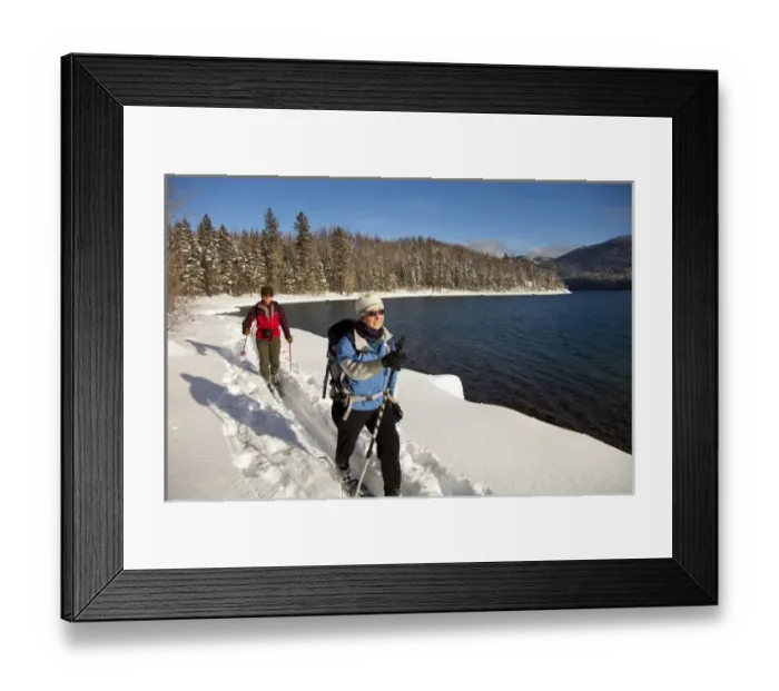 Framed Print : Cross country skiing along Lake McDonald in Glacier National Park in Montana (MR) Framed Print : Cross country skiing along Lake McDonald in Glacier National Park in Montana (MR)
