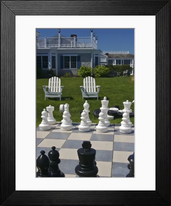 Framed Print : USA, Massachusetts, Chatham. Looking towards chairs and buildings from a giant chess