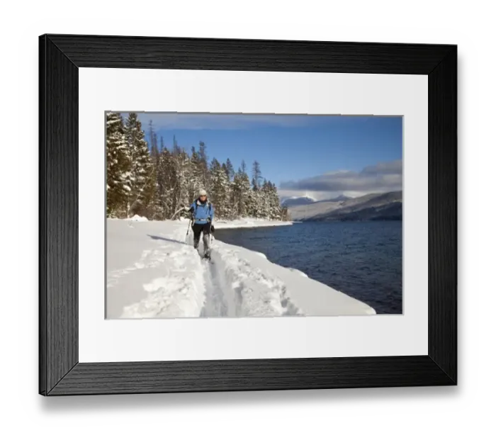 Framed Print : Cross country skiing along Lake McDonald in Glacier National Park in Montana (MR) Framed Print : Cross country skiing along Lake McDonald in Glacier National Park in Montana (MR)