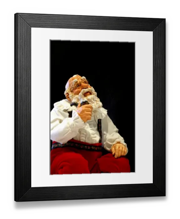 Framed Print : Holiday still life. Simpich Caracter doll, thinking Santa with pipe. Property released Framed Print : Holiday still life. Simpich Caracter doll, thinking Santa with pipe. Property released