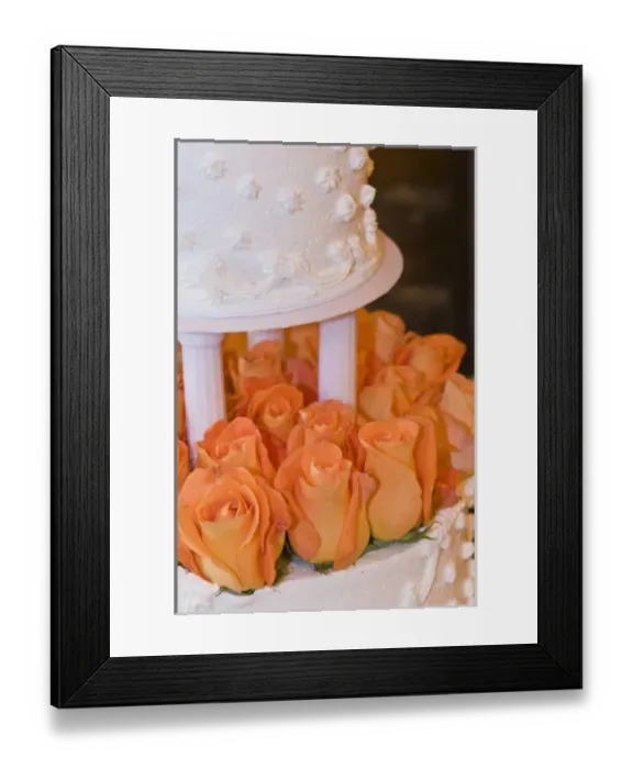 Framed Print : Detail of tiered wedding cake decorated with orange roses Framed Print : Detail of tiered wedding cake decorated with orange roses