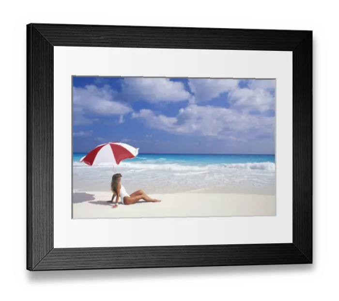 Framed Print : Woman sitting on tropical beach with umbrella (MR) Framed Print : Woman sitting on tropical beach with umbrella (MR)
