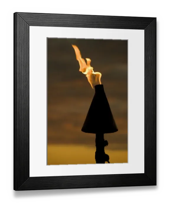 Framed Print : Fiji, Viti Levu, Lautoka. Tiki torch against evening sky