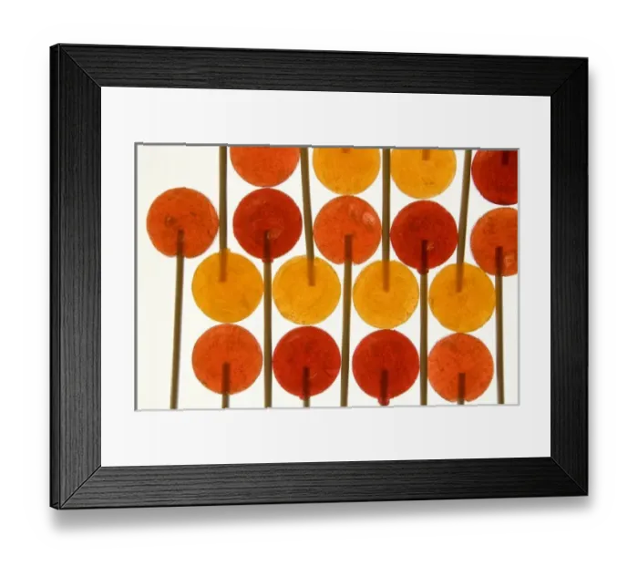 Framed Print : Design with red and orange lollipop candy on sticks