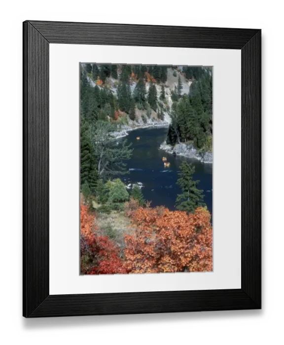 Framed Print : A group of rafts floating down a river in autumn
